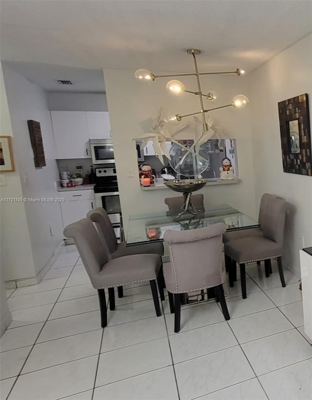 dining room featuring light tile patterned flooring