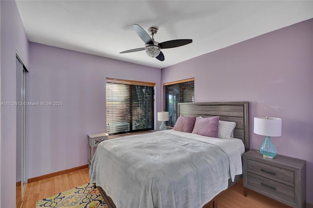 bedroom with ceiling fan and light hardwood / wood-style flooring