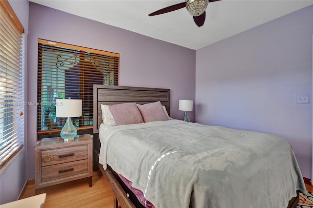 bedroom featuring ceiling fan and light hardwood / wood-style flooring