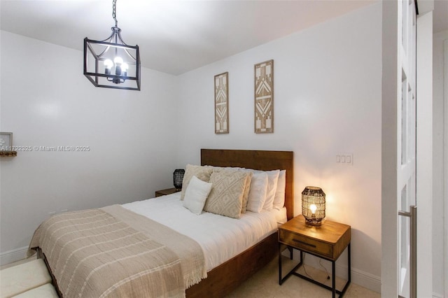 bedroom with an inviting chandelier