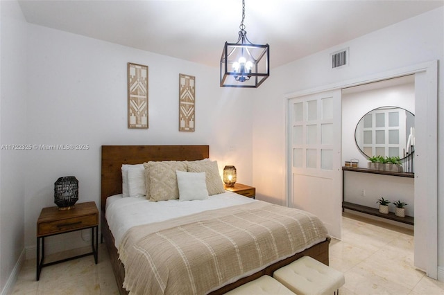 bedroom with an inviting chandelier