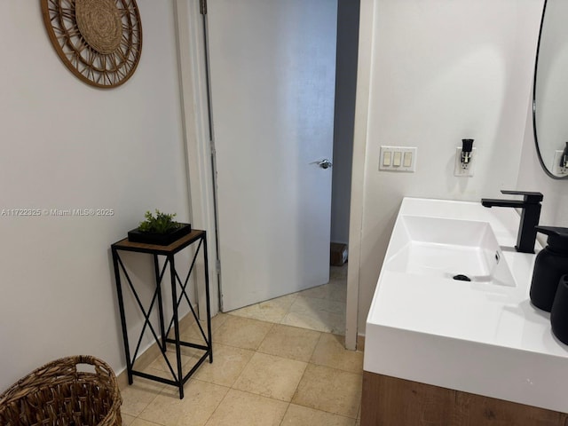 bathroom with tile patterned flooring and vanity