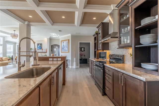 kitchen featuring sink, wall chimney range hood, light hardwood / wood-style floors, appliances with stainless steel finishes, and ornamental molding