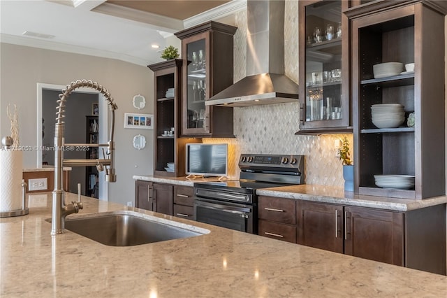 kitchen featuring decorative backsplash, wall chimney exhaust hood, light stone countertops, and stainless steel range with electric cooktop