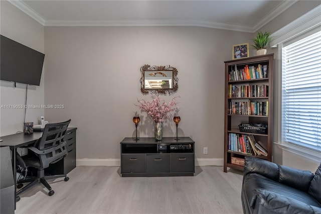 office space with light wood-type flooring and ornamental molding