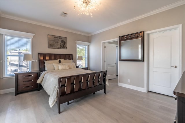 bedroom featuring multiple windows, light hardwood / wood-style flooring, an inviting chandelier, and ornamental molding