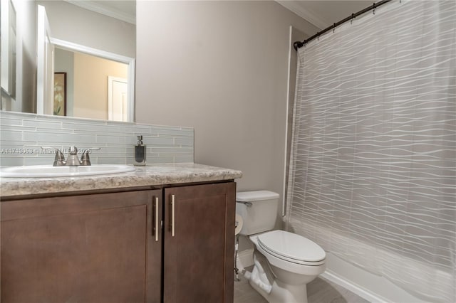 bathroom featuring vanity, toilet, ornamental molding, and backsplash