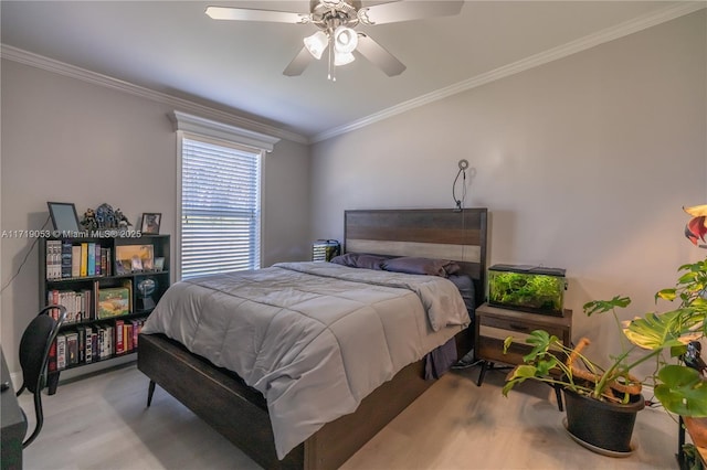 bedroom with ceiling fan, light hardwood / wood-style floors, and ornamental molding