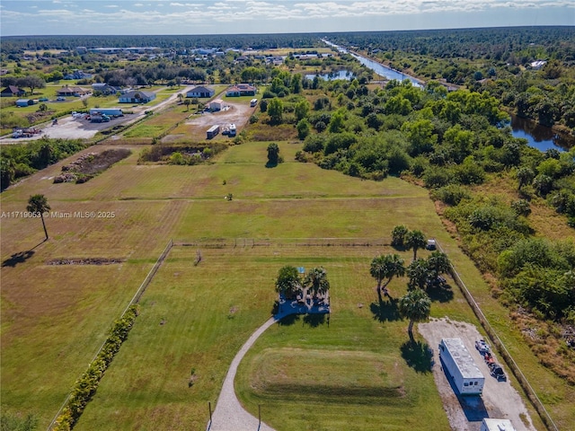 bird's eye view with a water view and a rural view