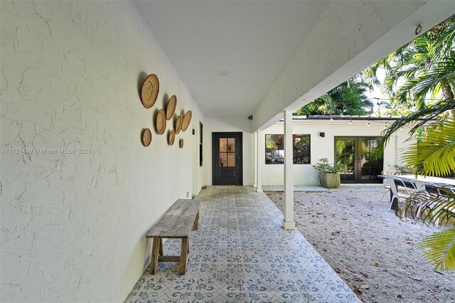 exterior space with french doors and a patio area