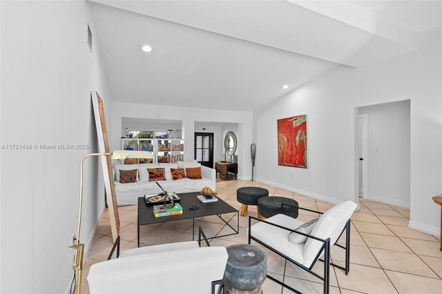 tiled living room with lofted ceiling