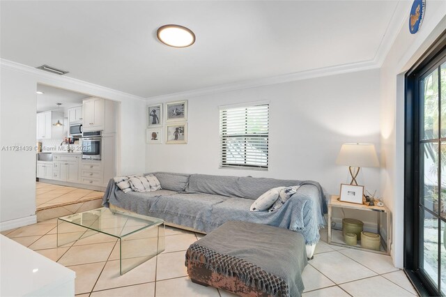 tiled living room featuring ornamental molding