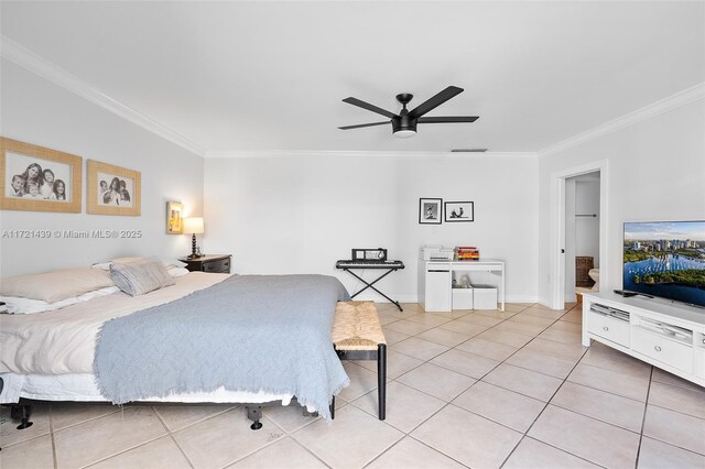 tiled bedroom with ceiling fan and ornamental molding