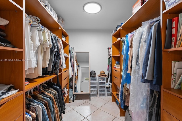 spacious closet with light tile patterned flooring