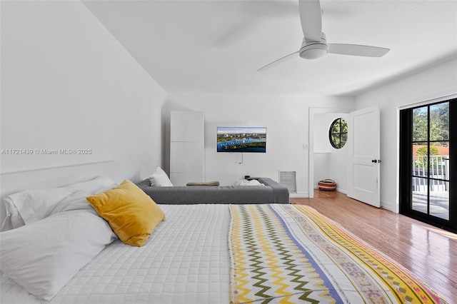 bedroom featuring ceiling fan, light hardwood / wood-style floors, and access to outside