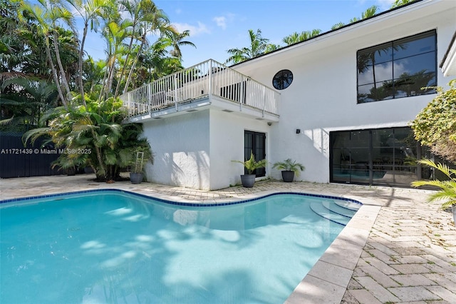 view of pool featuring a patio area