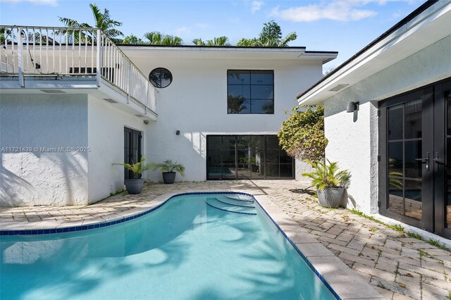 view of pool featuring a patio