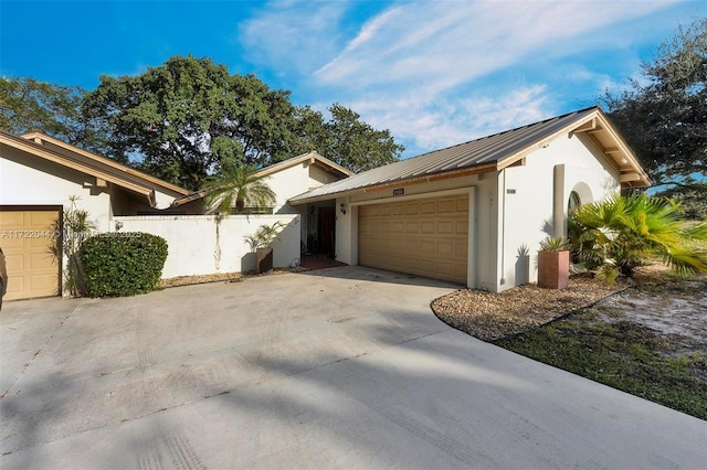 view of front facade with a front lawn and a garage