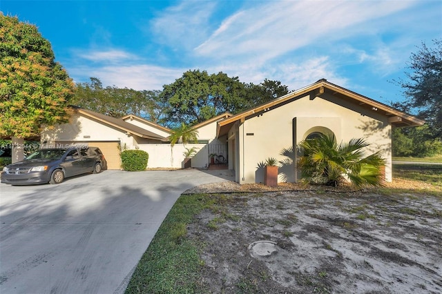 ranch-style home featuring a garage