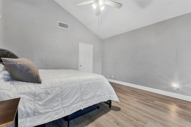 bedroom featuring ceiling fan, wood-type flooring, and high vaulted ceiling