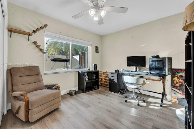 home office featuring ceiling fan and light hardwood / wood-style floors