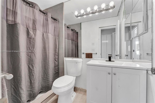 bathroom with toilet, vanity, and a shower with shower curtain