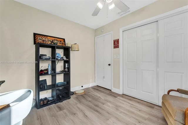 interior space with ceiling fan and light wood-type flooring