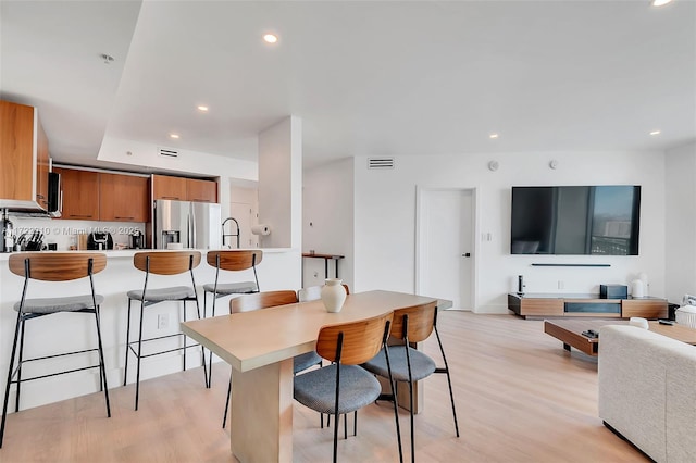 dining room with light hardwood / wood-style flooring