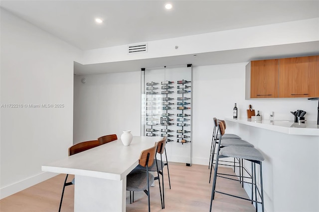 dining space with light wood-type flooring