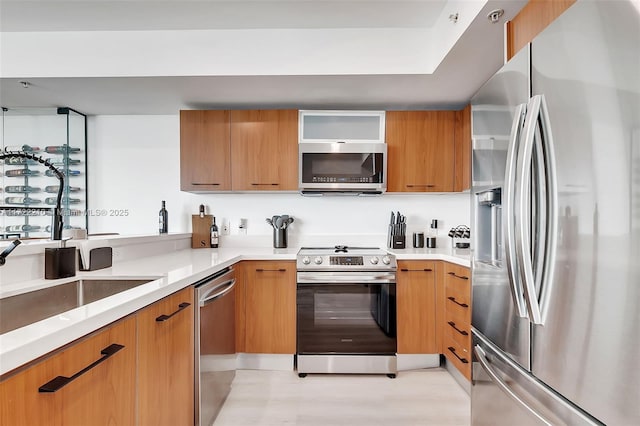 kitchen with appliances with stainless steel finishes and sink