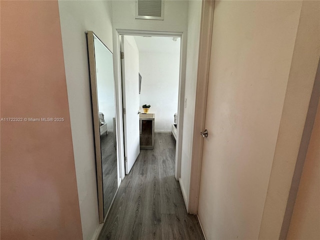 hallway featuring dark wood-type flooring