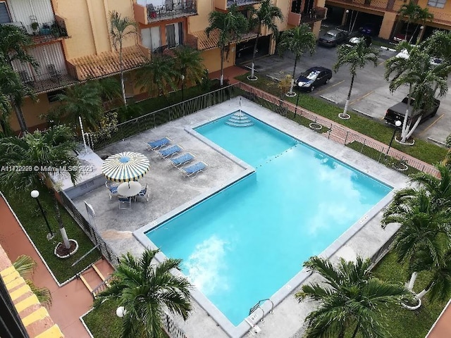 view of swimming pool with a patio area