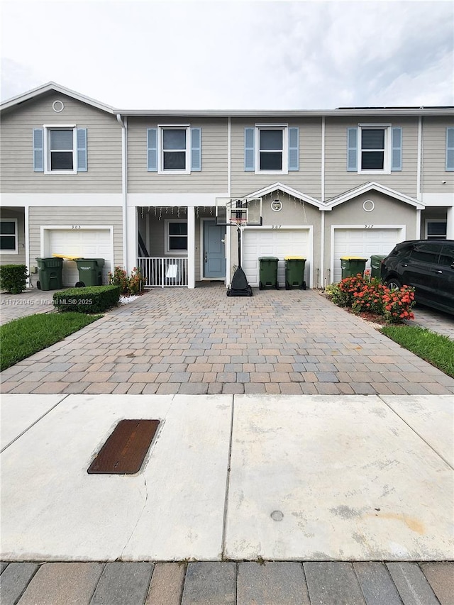 view of front of home with a porch and a garage