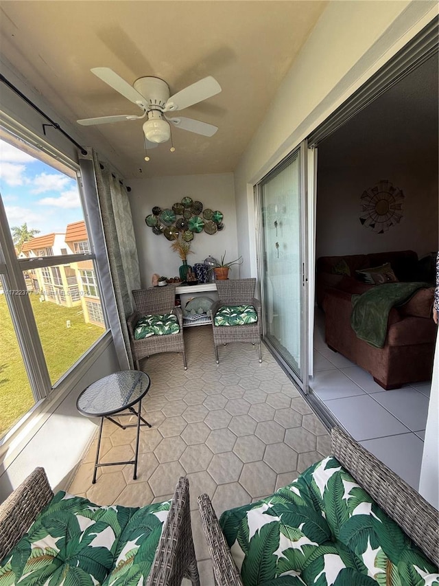 sunroom / solarium with ceiling fan