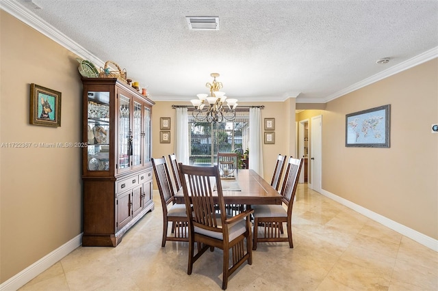 dining room with a textured ceiling, crown molding, and a notable chandelier