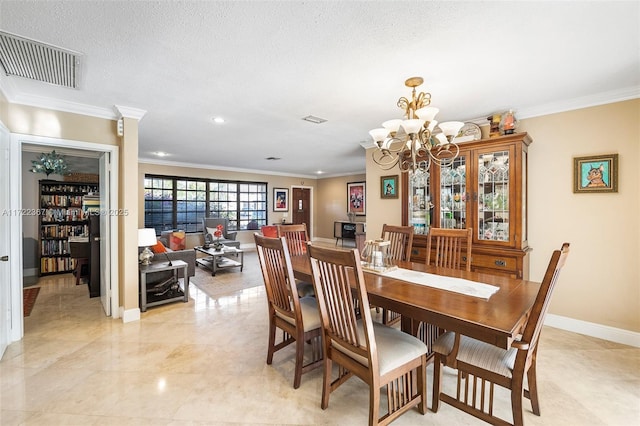 dining room featuring crown molding, a textured ceiling, and a notable chandelier