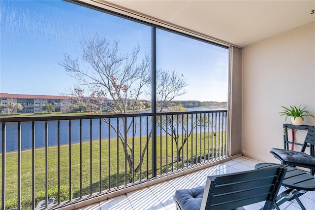 balcony featuring a water view