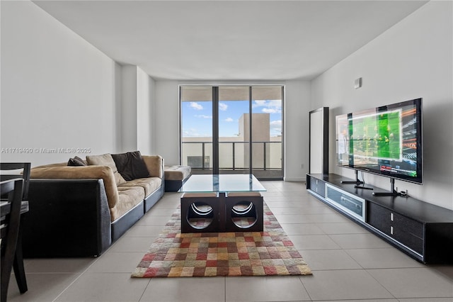 tiled living room with a wall of windows