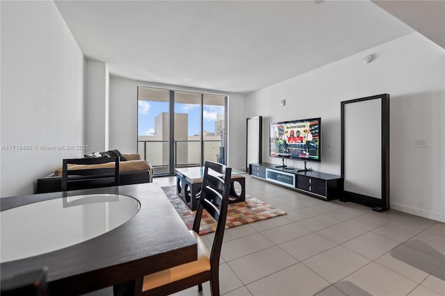 dining room with light tile patterned floors and expansive windows