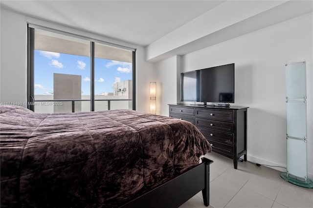 bedroom featuring expansive windows