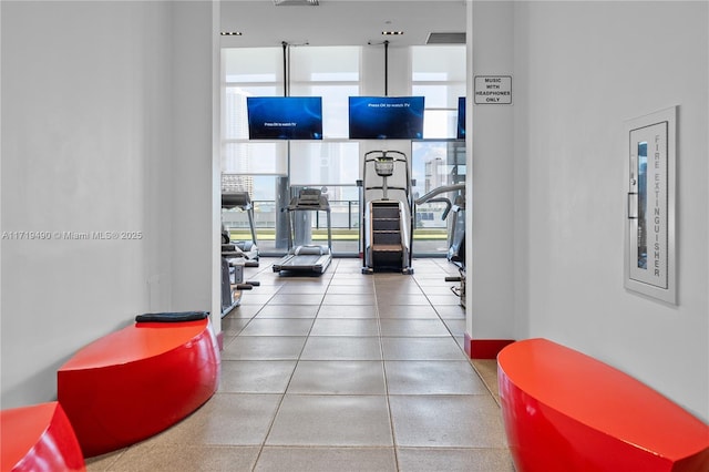 gym featuring floor to ceiling windows