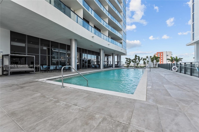 view of pool featuring a patio