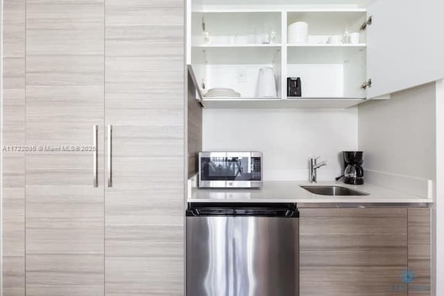 kitchen with sink and appliances with stainless steel finishes