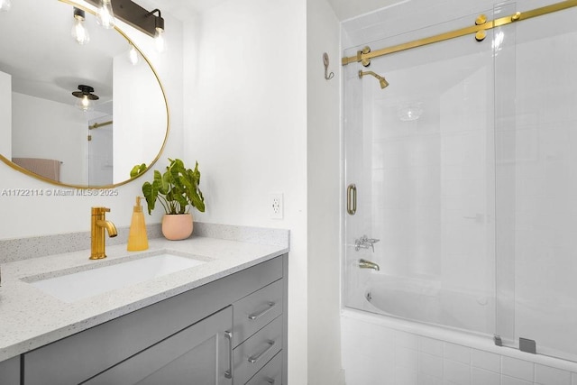 bathroom featuring vanity and enclosed tub / shower combo