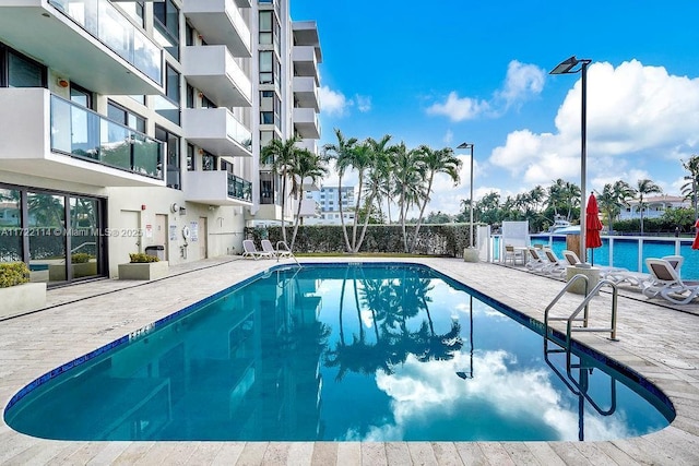 view of swimming pool with a patio