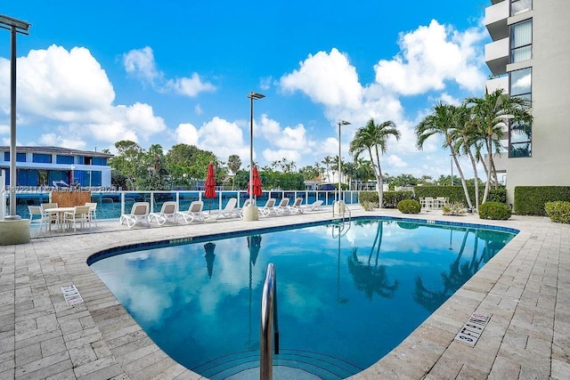 view of swimming pool with a patio area