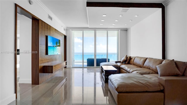 living room featuring floor to ceiling windows and ornamental molding