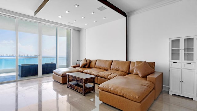 living room featuring a water view and a wall of windows