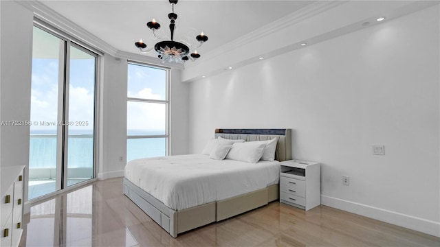 bedroom featuring a chandelier, access to outside, a water view, and ornamental molding