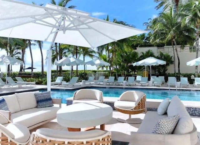 view of pool featuring an outdoor hangout area and a patio